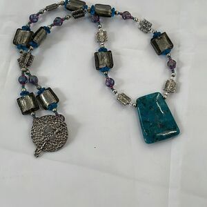 Chunky  glass metal and stone necklace .